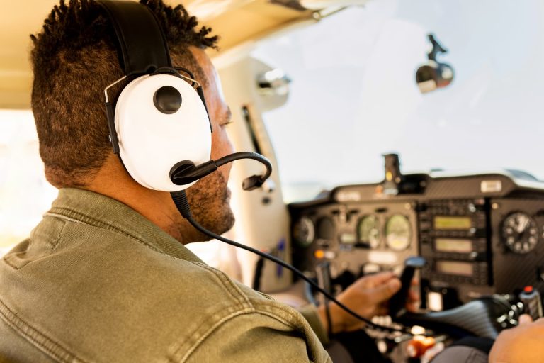 A man in the cockpit of a light aircraft, piloting the plane he is considering purchasing