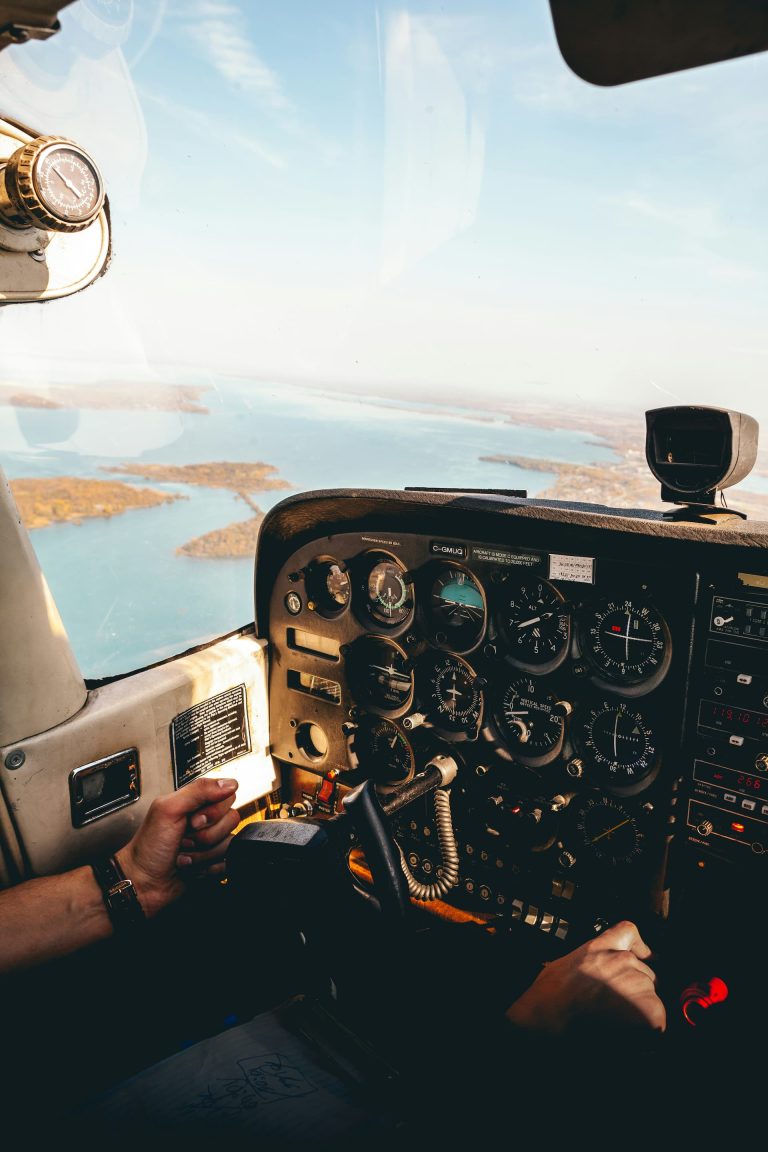The view from the cockpit of a small plane while flying over the coastline