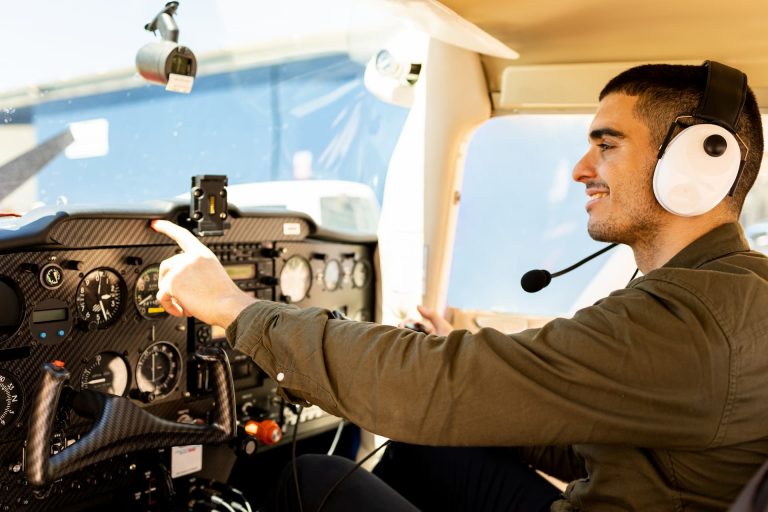 A pilot setting in the cockpit of his new light aircraft, preparing for take-off